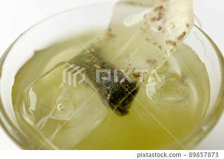Green tea on white background Green tea on white background 89857873