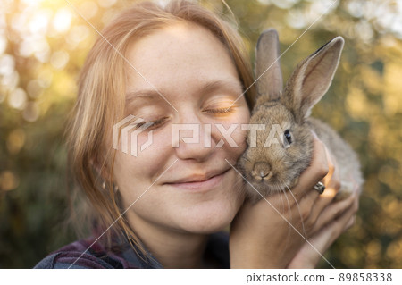 girl and rabbit 89858338