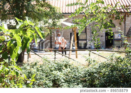 mother and daughter play on the playground 89858879