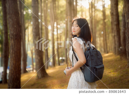 Asian girl travel and walk on the bridge at Pang umg park Asian girl travel and walk on the bridge at Pang umg park 89861643