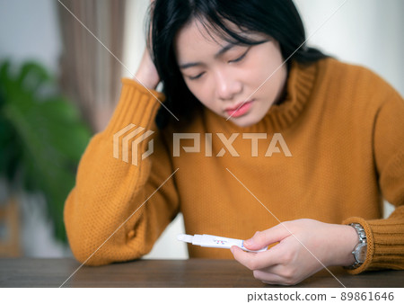 Asian lady check covid19 coronavirus omicron by use soliva antigen test kid by her self Asian lady check covid19 coronavirus omicron by use soliva antigen test kid by her self 89861646