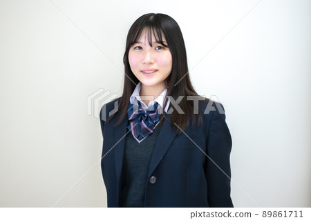 High school girl in uniform white background High school girl in uniform white background 89861711