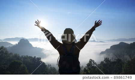 Asian traveller with camera take photo for a fog on a mountain at Japo village Asian traveller with camera take photo for a fog on a mountain at Japo village 89861749