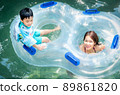 Asian boy and he mother playing in  water park 89861820