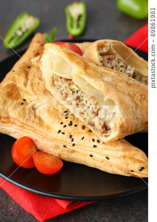 Concept of tasty food with samsa on dark textured background Concept of tasty food with samsa on dark textured background 89861981