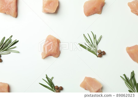 Flat lay composition with slices of raw chicken fillet on white background Flat lay composition with slices of raw chicken fillet on white background 89862023