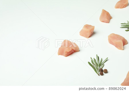 Flat lay composition with slices of raw chicken fillet on white background Flat lay composition with slices of raw chicken fillet on white background 89862024
