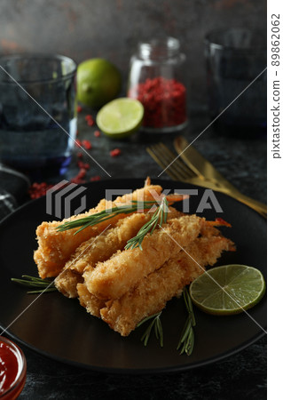 Concept of tasty food with deep-fried shrimp on dark table 89862062
