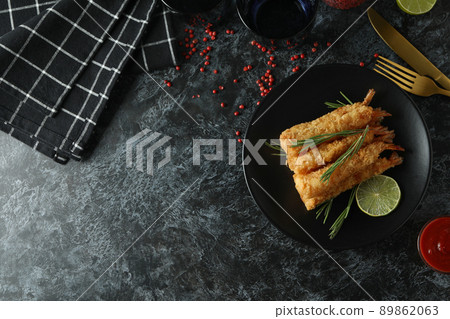 Concept of tasty food with deep-fried shrimp on dark table Concept of tasty food with deep-fried shrimp on dark table 89862063