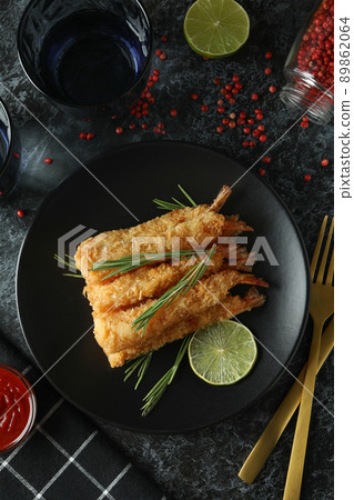 Concept of tasty food with deep-fried shrimp on dark table Concept of tasty food with deep-fried shrimp on dark table 89862064