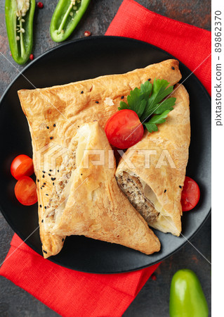 Concept of tasty food with samsa on dark textured background 89862370