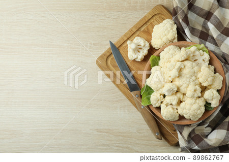 Concept of tasty food with cauliflower on wooden background Concept of tasty food with cauliflower on wooden background 89862767