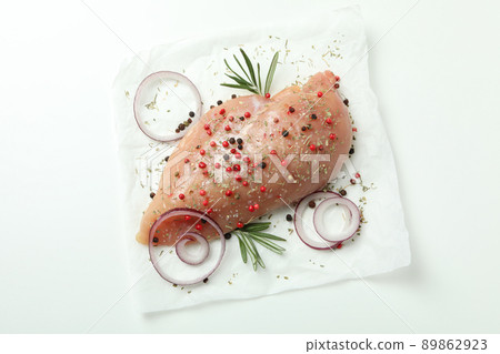 Raw chicken fillet with ingredients on white background Raw chicken fillet with ingredients on white background 89862923