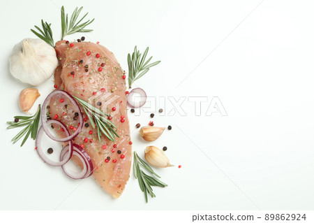 Raw chicken fillet with ingredients on white background Raw chicken fillet with ingredients on white background 89862924