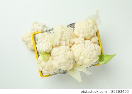 Slices of fresh juicy cauliflower in basket on white background Slices of fresh juicy cauliflower in basket on white background 89863403