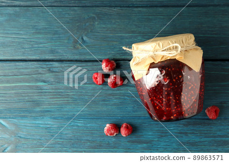 Jar of raspberry jam with ingredients on wooden background Jar of raspberry jam with ingredients on wooden background 89863571