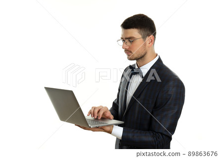 Businessman with laptop isolated on white background 89863676