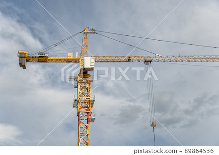 Yellow construction cranes 89864536