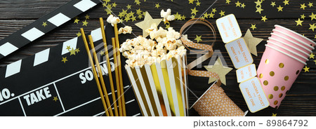 Concept of cinema accessories on wooden background Concept of cinema accessories on wooden background 89864792