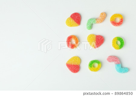 Gummy candies on white background, space for text Gummy candies on white background, space for text 89864850