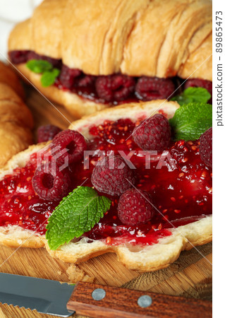 Concept of delicious food with croissants with raspberry jam, close up 89865473