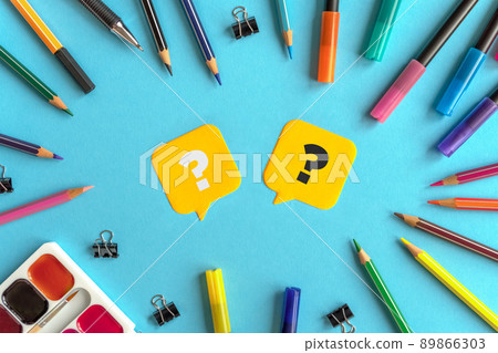 Many stationary supplies on blue background with question marks. Office accessories flat lay. First September, back to school, education, creativity concept. Pens, pencils and paints with copyspace Many stationary supplies on blue background with question marks. Office accessories flat lay. First September, back to school, education, creativity concept. Pens, pencils and paints with copyspace 89866303