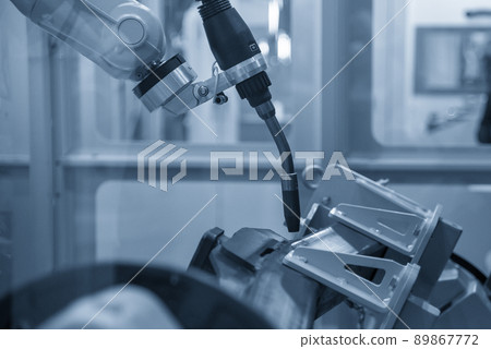 The automatic welding robot working with automotive parts assembly processing. The automatic welding robot working with automotive parts assembly processing. 89867772