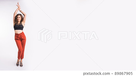 Latina dance or strip dance contemporary and bachata lady banner - Woman dancing improvisation on white background with copy space and place for text Latina dance or strip dance contemporary and bachata lady banner - Woman dancing improvisation on white background with copy space and place for text 89867905