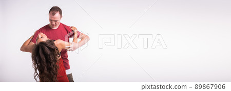 Dancers couple dancing social latin dance bachata kizomba salsa - social dance. Two elegance pose on white background with copy space banner and place for advertising Dancers couple dancing social latin dance bachata kizomba salsa - social dance. Two elegance pose on white background with copy space banner and place for advertising 89867906