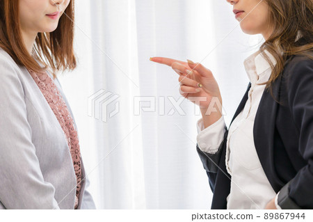 Two women who are scolded by their boss 89867944