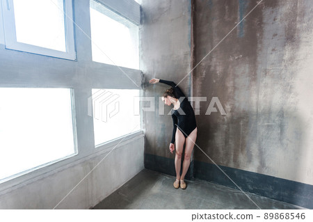 Elegance lady dancing near window. Studio shot, indoor Elegance lady dancing near window. Studio shot, indoor 89868546