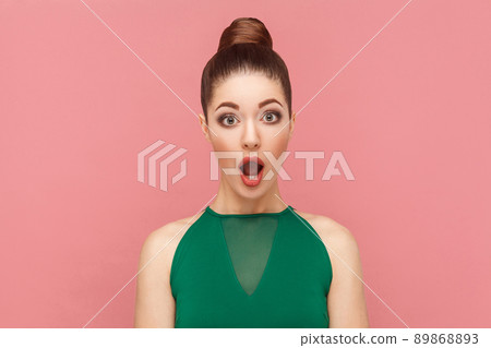 Portrait of amazement beautiful woman with perfect makeup. Expression emotion and feelings concept. Studio shot, isolated on pink background 89868893