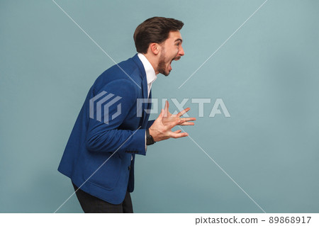 Profile portrait of stressed manager in work shout, roar. Business people concept, richly and success. Indoor, studio shot on light blue background 89868917