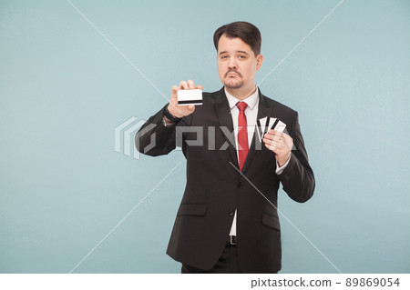 One bank card will replace all your other cards. Indoor, studio shot, isolated on light blue or gray background 89869054