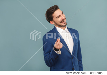Give me money. Foxy businessman toothy smiling . Business people concept, richly and success. Indoor, studio shot on light blue background 89869059