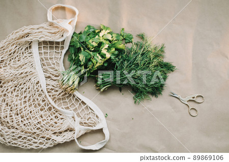 Bunches of fresh greens and organic herbs on beige background. Healthy food. Flat lay, top view, copy space 89869106