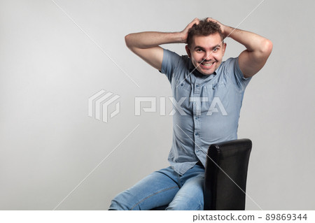 Happiness man toothy smiling at camera. Actors portfolio picture, emotion and feelings. Studio shot, isolated on gray background Happiness man toothy smiling at camera. Actors portfolio picture, emotion and feelings. Studio shot, isolated on gray background 89869344