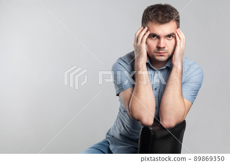 Portrait of worried man in depression. Actors portfolio picture, emotion and feelings. Studio shot, isolated on gray background Portrait of worried man in depression. Actors portfolio picture, emotion and feelings. Studio shot, isolated on gray background 89869350