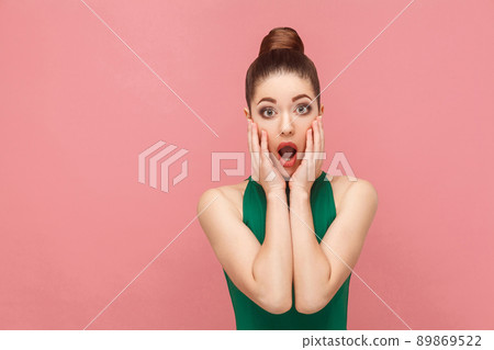 Portrait of woman with shocked face. Expression emotion and feelings concept. Studio shot, isolated on pink background Portrait of woman with shocked face. Expression emotion and feelings concept. Studio shot, isolated on pink background 89869522