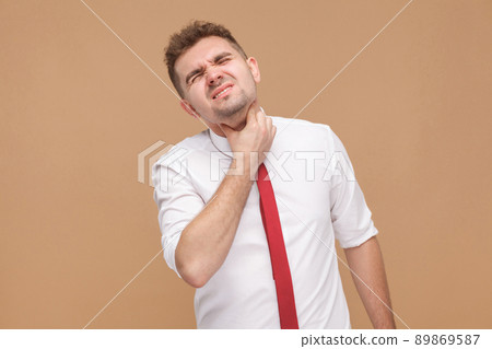 Unwell man have gripe and virus. Business people concept, good and bad emotion and feelings. Studio shot, isolated on light brown background 89869587