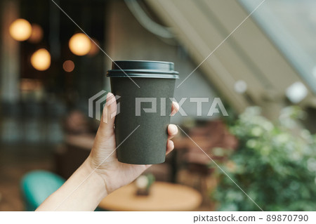 Above view of unrecognizable man taking photo of black coffee and croissant on table in cafe, bloggers lifestyle concept Above view of unrecognizable man taking photo of black coffee and croissant on table in cafe, bloggers lifestyle concept 89870790