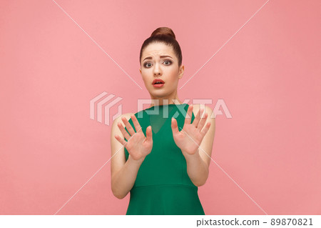 No! Fear reaction of beautiful woman . Expression emotion and feelings concept. Studio shot, isolated on pink background No! Fear reaction of beautiful woman . Expression emotion and feelings concept. Studio shot, isolated on pink background 89870821