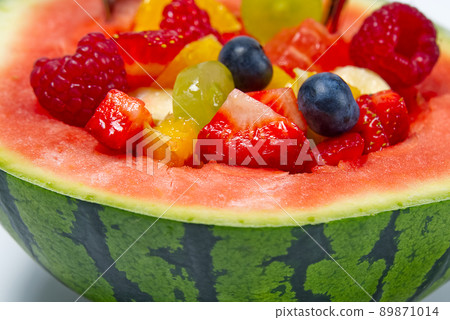 Watermelon filled with fresh fruit salad. summer fresh fruits salad close-up. 89871014