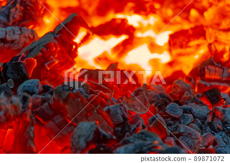 red hot coals in a blast furnace for metal melting. metal mining and processing industry. Red coals from a burnt fire made of wood red hot coals in a blast furnace for metal melting. metal mining and processing industry. Red coals from a burnt fire made of wood 89871072