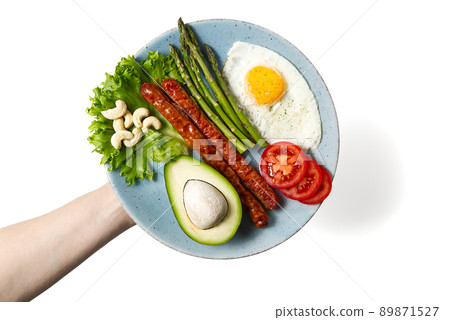Healthy homemade breakfast with asparagus, fried egg and arugula. quarantine healthy eating concept. keto diet. Healthy homemade breakfast with asparagus, fried egg and arugula. quarantine healthy eating concept. keto diet. 89871527