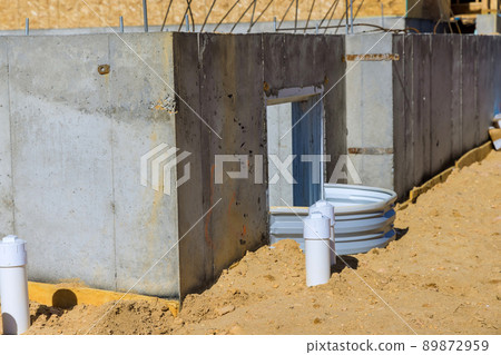 New residential home with window well for basement construction 89872959