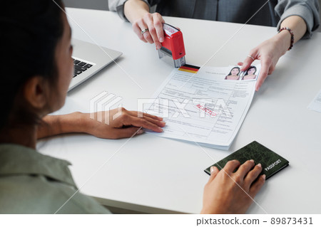 Young adult woman failing interview in embassy and getting visa application rejected, high angle shot 89873431