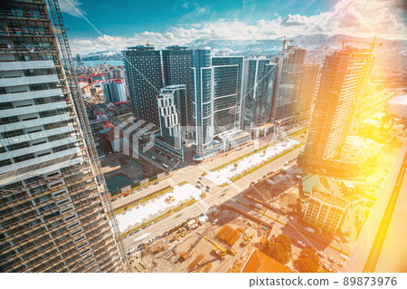 Development Multistorey Residential Building construction area. development on construction site. flat view Construction And bulding industry concept. Morning Evening sunswt sunrise time 89873976