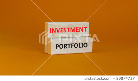 Investment portfolio symbol. Wooden blocks with concept words Investment portfolio on beautiful orange background. Business investment portfolio concept. Copy space. Investment portfolio symbol. Wooden blocks with concept words Investment portfolio on beautiful orange background. Business investment portfolio concept. Copy space. 89874737