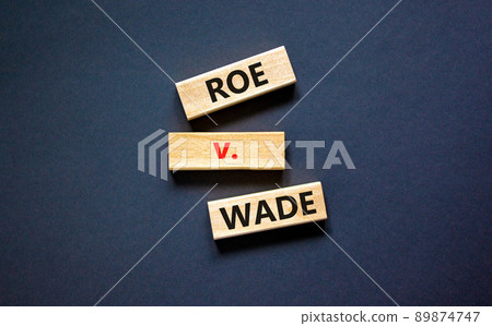 Abortion process Roe versus Wade symbol. Concept words Roe versus Wade on wooden blocks. Beautiful black table black background. Abortion process Roe versus Wade concept. Copy space. Abortion process Roe versus Wade symbol. Concept words Roe versus Wade on wooden blocks. Beautiful black table black background. Abortion process Roe versus Wade concept. Copy space. 89874747